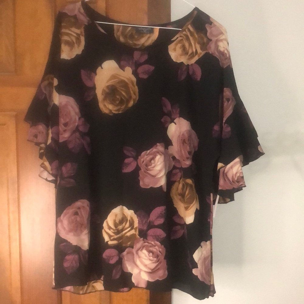 Blouse with cute bell/ruffle sleeve.
